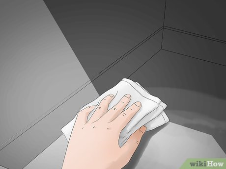 Step 8 Вытрите остатки пасты и уксуса влажной тряпкой для посуды.